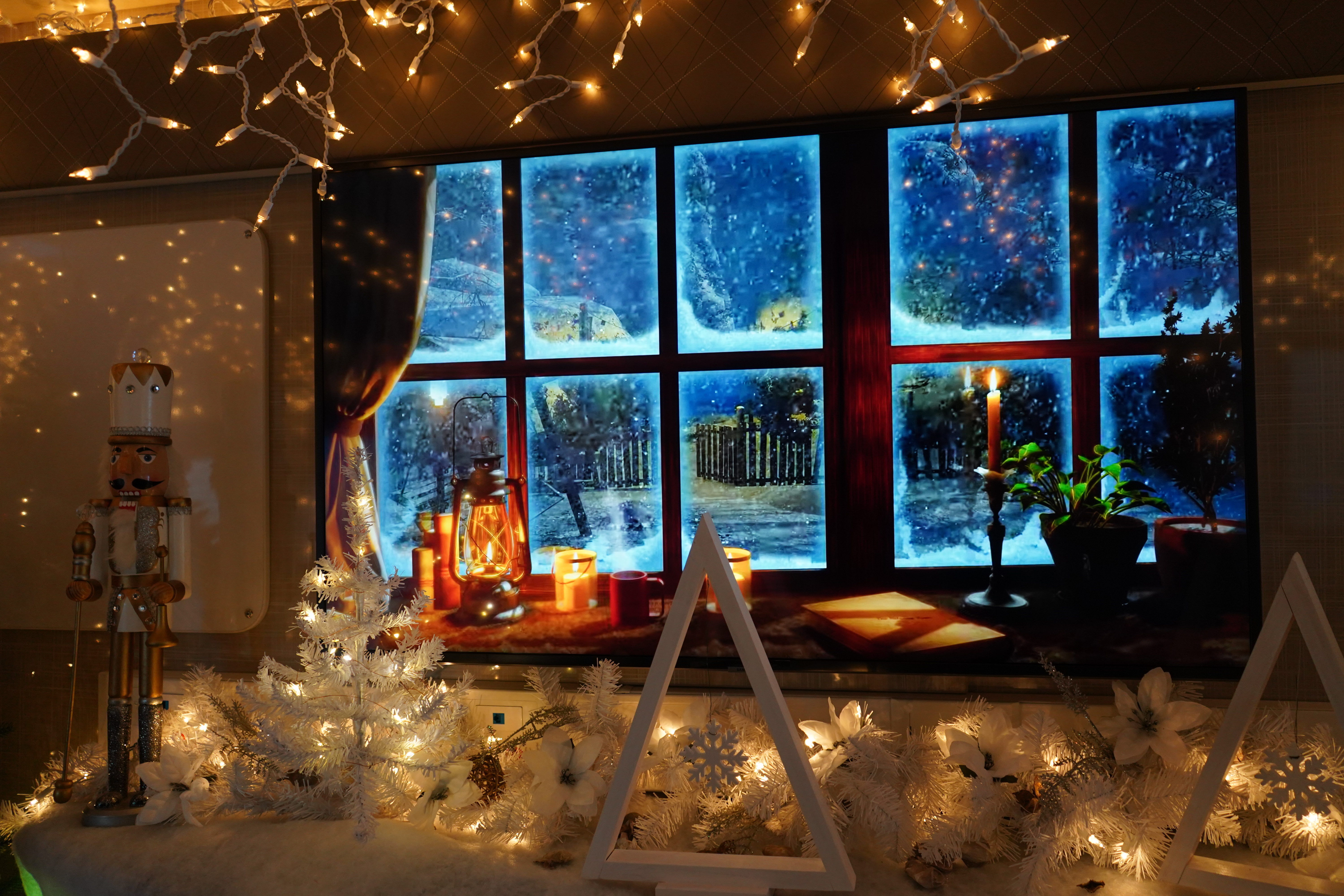 Photo of SLED decorated for the winter holidays, showing a miniature winter landscape.