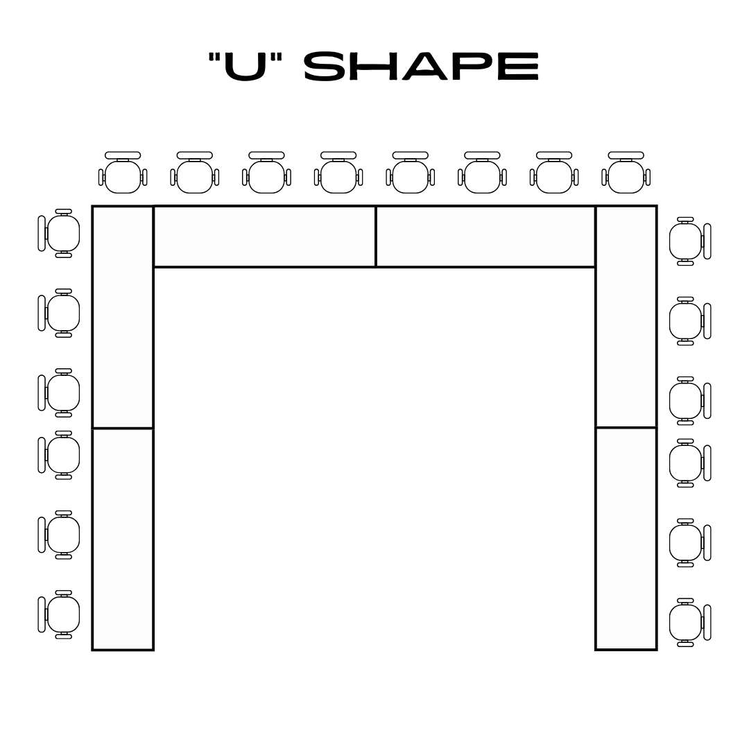 Board tables at front of room facing rows of audience chairs